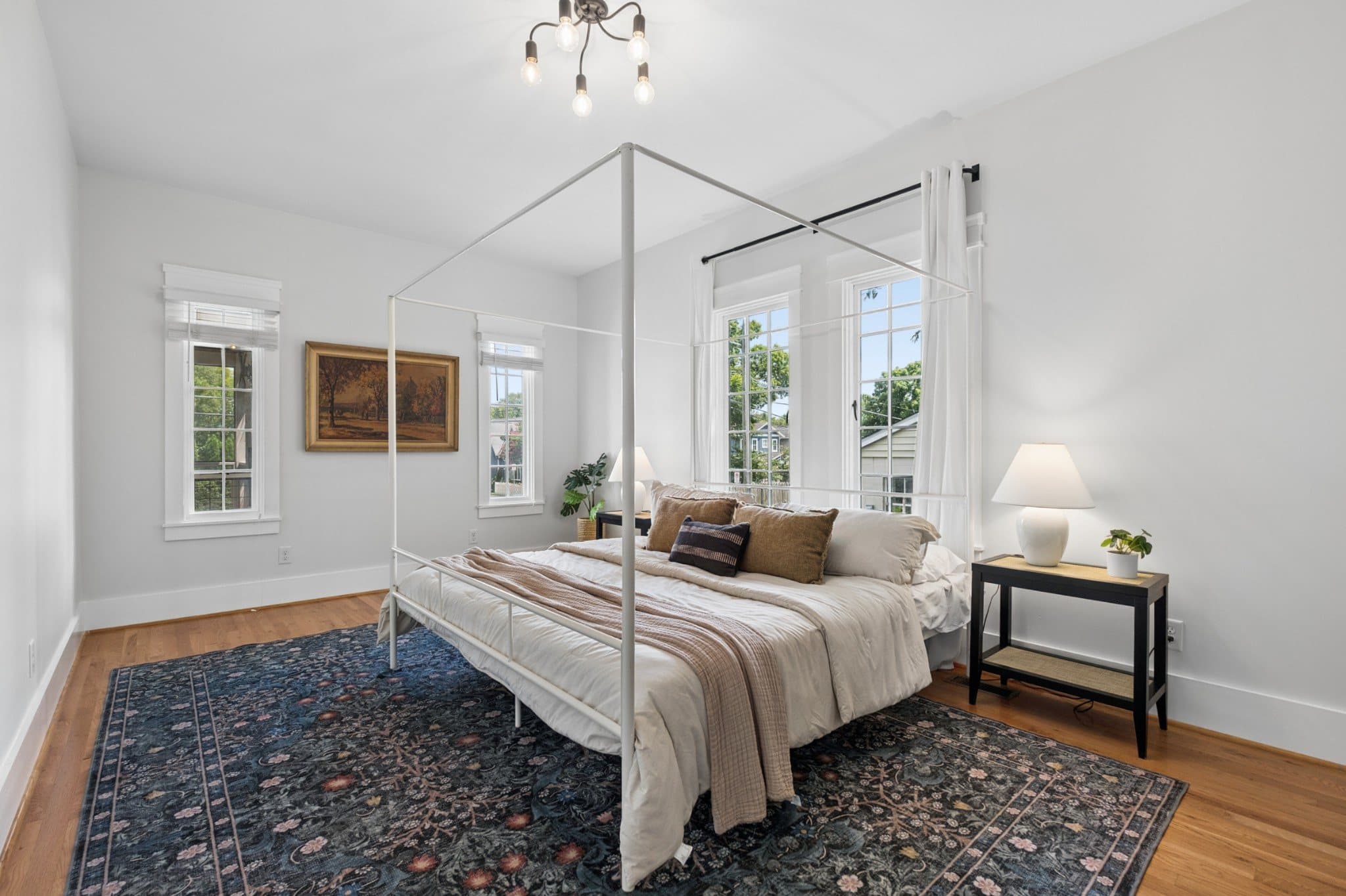 Bedroom with hardwood floors and tall windows at 1001 Caldwell Ave in 12 South Nashville