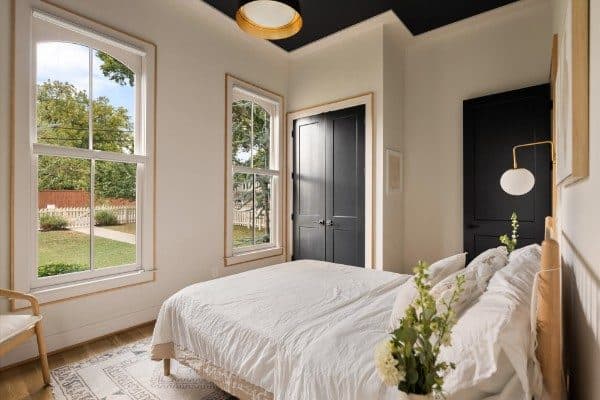 Bedroom with tall windows and a dark ceiling at 2020 10th Avenue South, 12 South Nashville