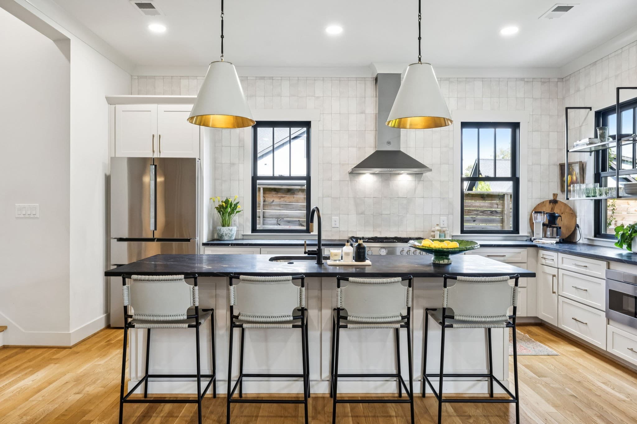 Expansive kitchen with large center island, pendant lights, and open connection to dining at 1101 Montrose Avenue in 12 South Nashville