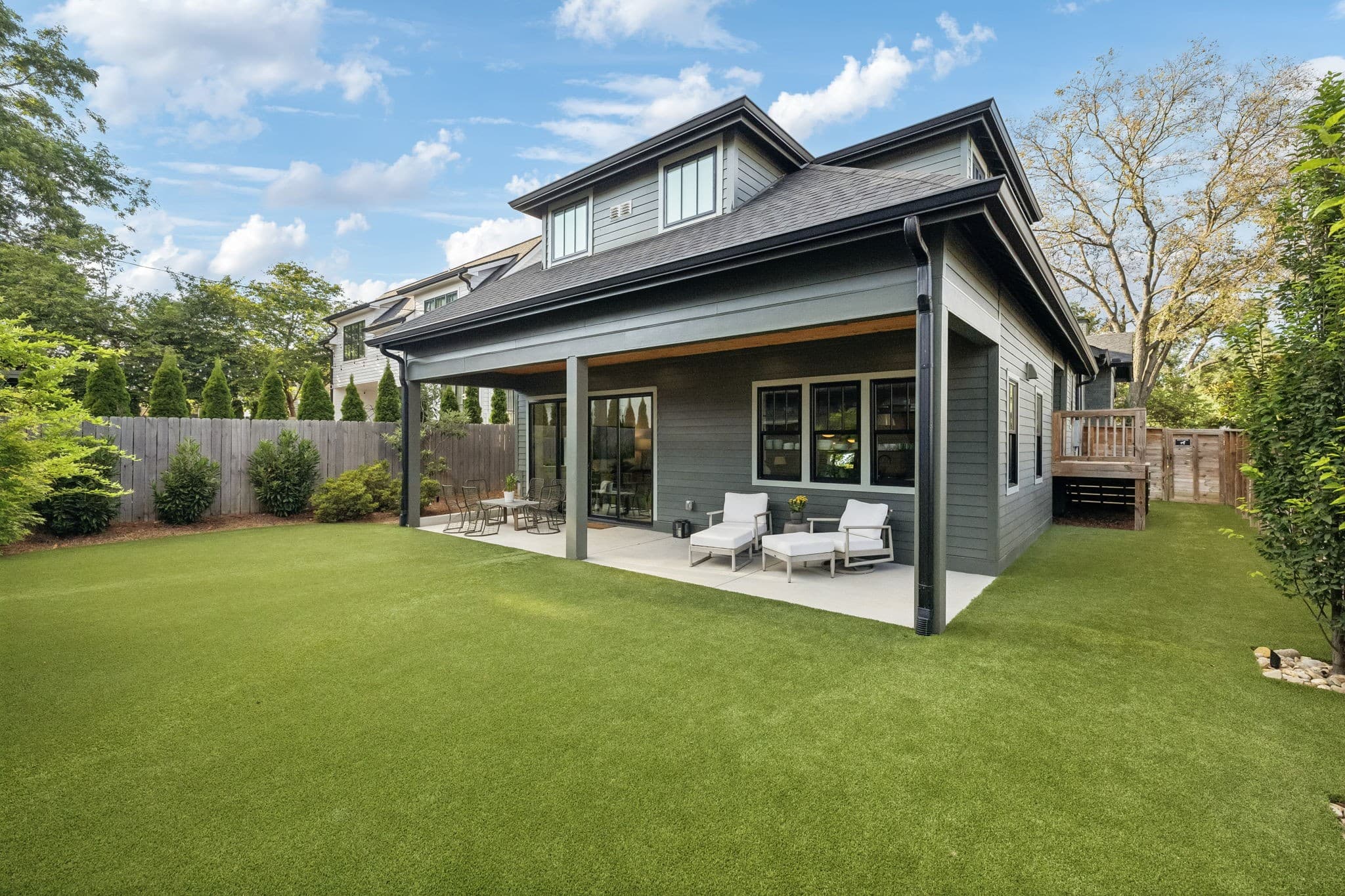 Rear exterior with covered patio and fenced turf yard at 1101 Montrose Avenue near 12 South Nashville
