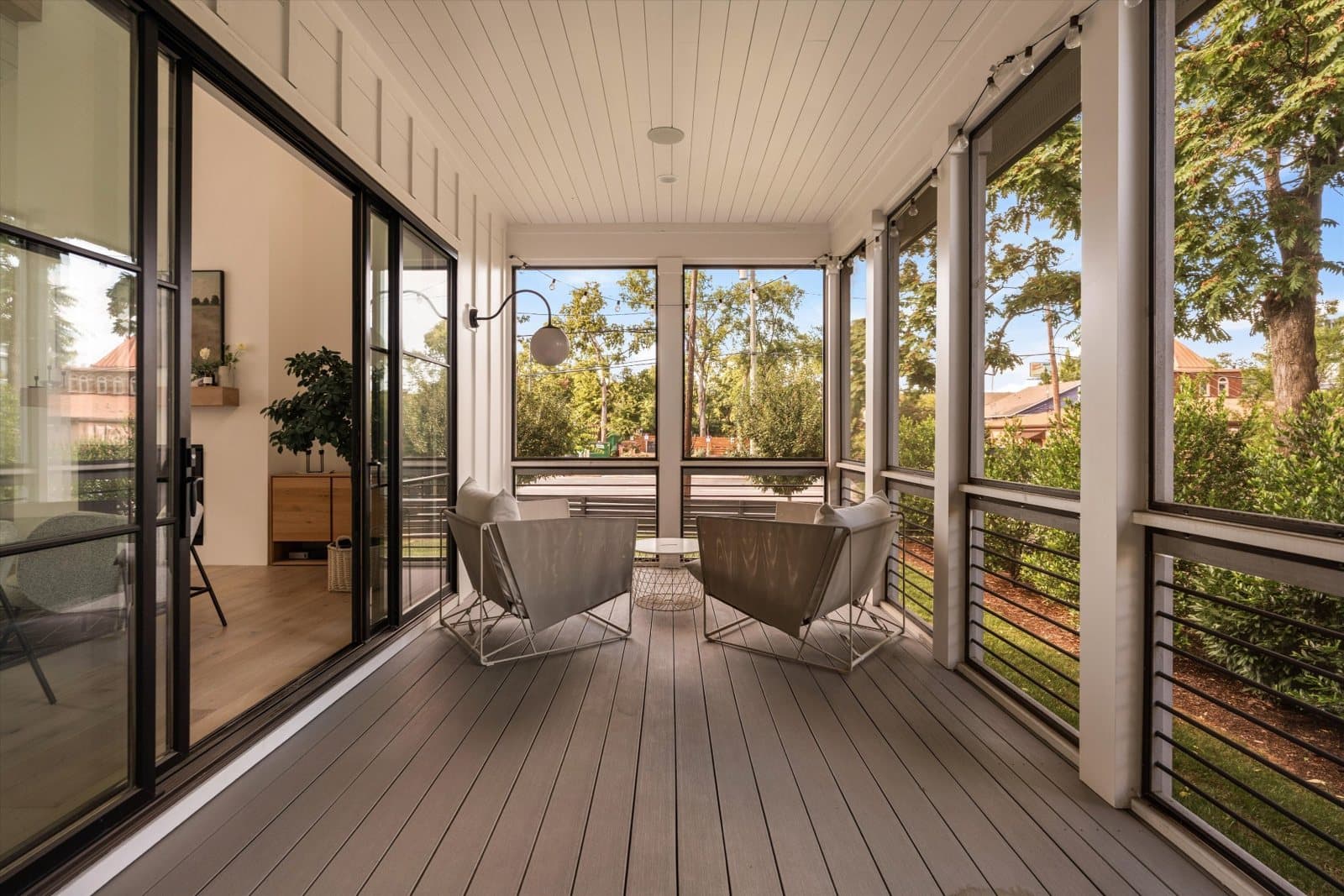 Oversized screened porch with wood ceiling and outdoor seating at 1207 Sweetbriar Ave in 12 South Nashville