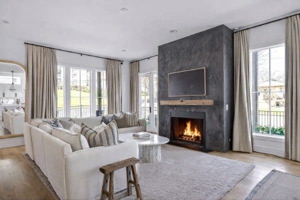 Living room with a gas fireplace and tall windows at 2080 12th Avenue South, 12 South Nashville
