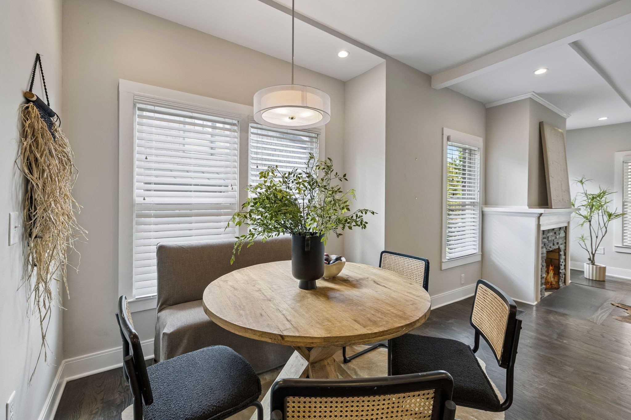 Bright kitchen with white cabinetry, oversized island, and pendant lighting at 1509 Ashwood Avenue near 12 South Nashville