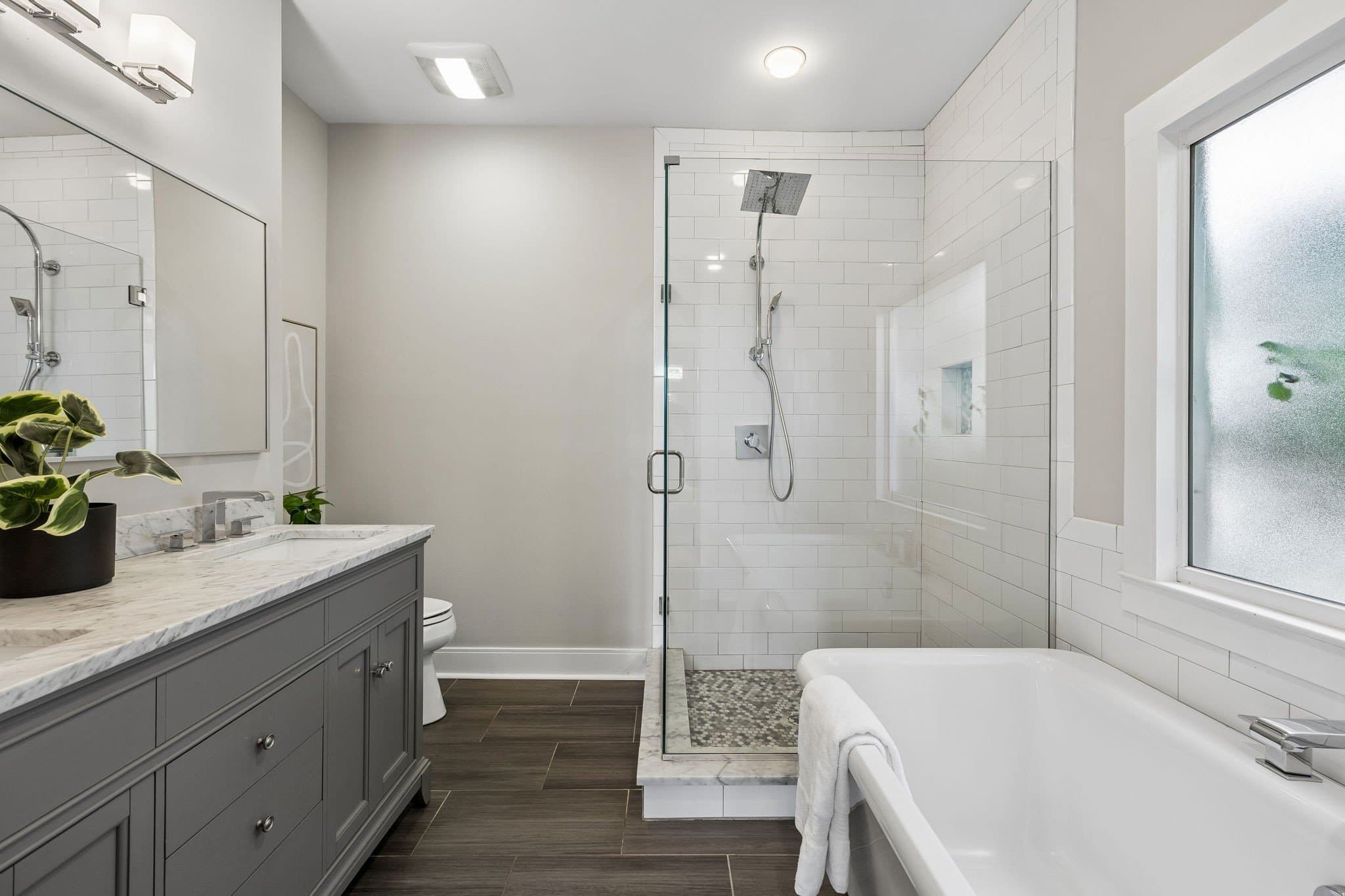 Spa inspired primary bath with soaking tub and walk in tile shower at 1509 Ashwood Avenue, 12 South Nashville area