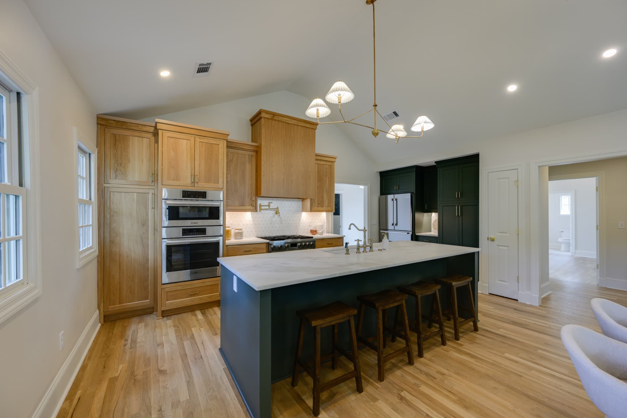 Kitchen with wood cabinets, marble topped island, double oven and Bosch appliances at 2600 Belmont Blvd in 12 South Nashville