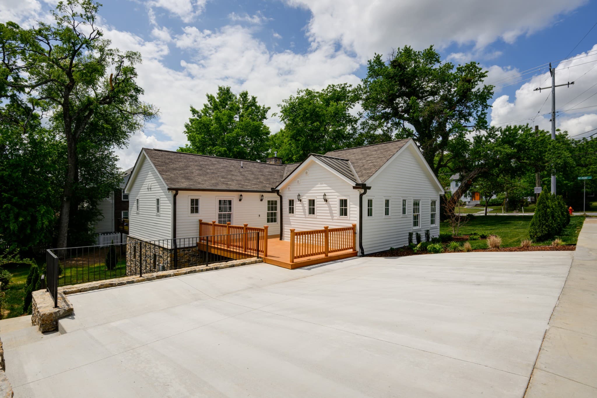 Side of 2600 Belmont Blvd with the rear deck and concrete driveway in 12 South Nashville