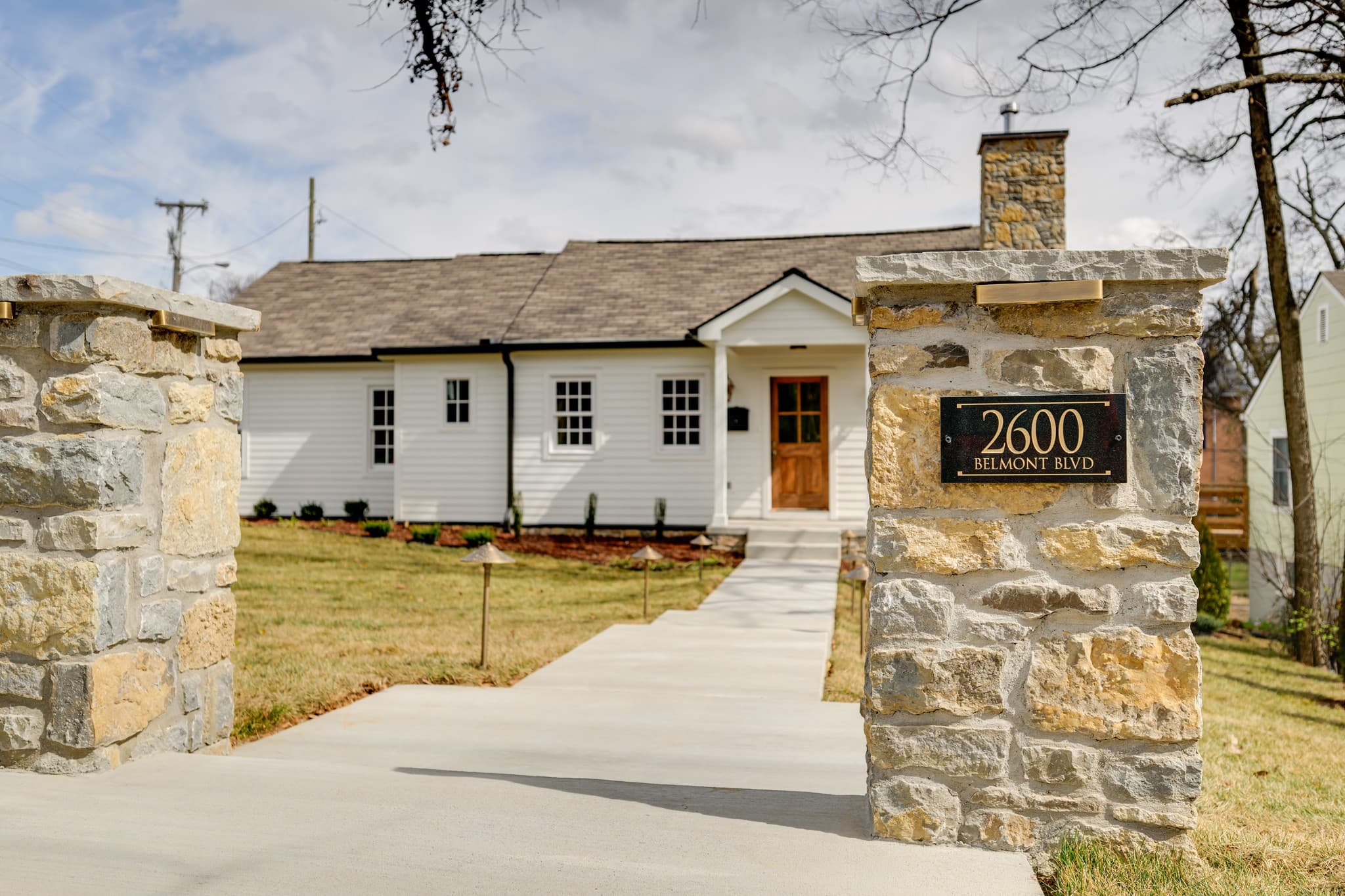 Stone gate pillar with the 2600 Belmont Blvd address sign and front walk in 12 South Nashville