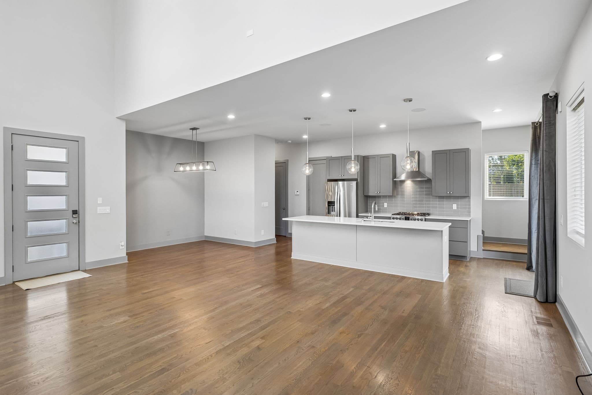 Open living room and kitchen with natural light at 2807B W Kirkwood Avenue in 12 South Nashville