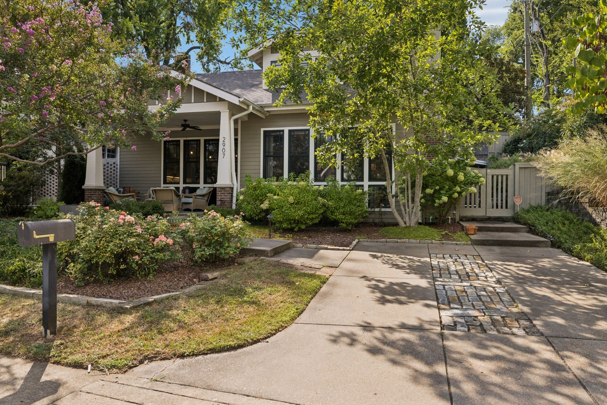 Front exterior of the Craftsman at 2907 Oakland Avenue with covered front porch near 12 South Nashville