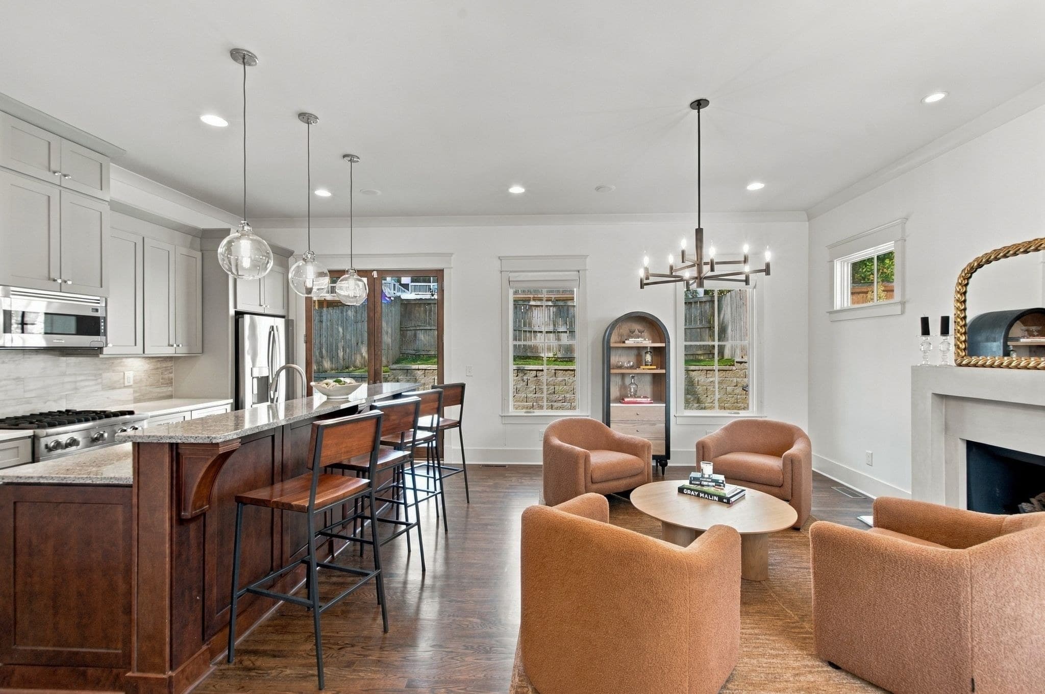 Open kitchen and living area with island and fireplace at 824B Horner Avenue in 12 South Nashville