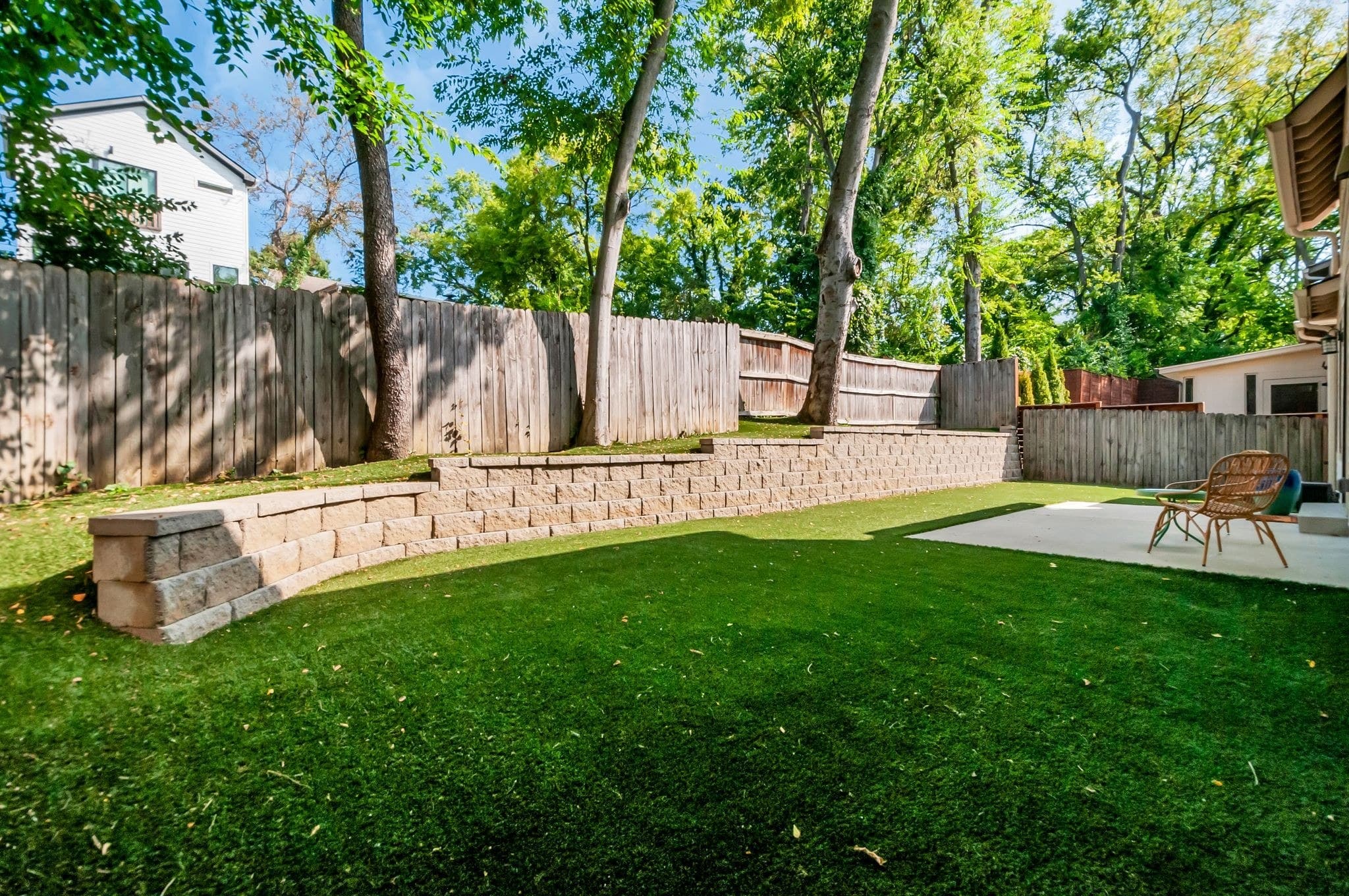 Fenced backyard with patio, eco turf lawn, and privacy fence at 824B Horner Avenue near 12 South Nashville