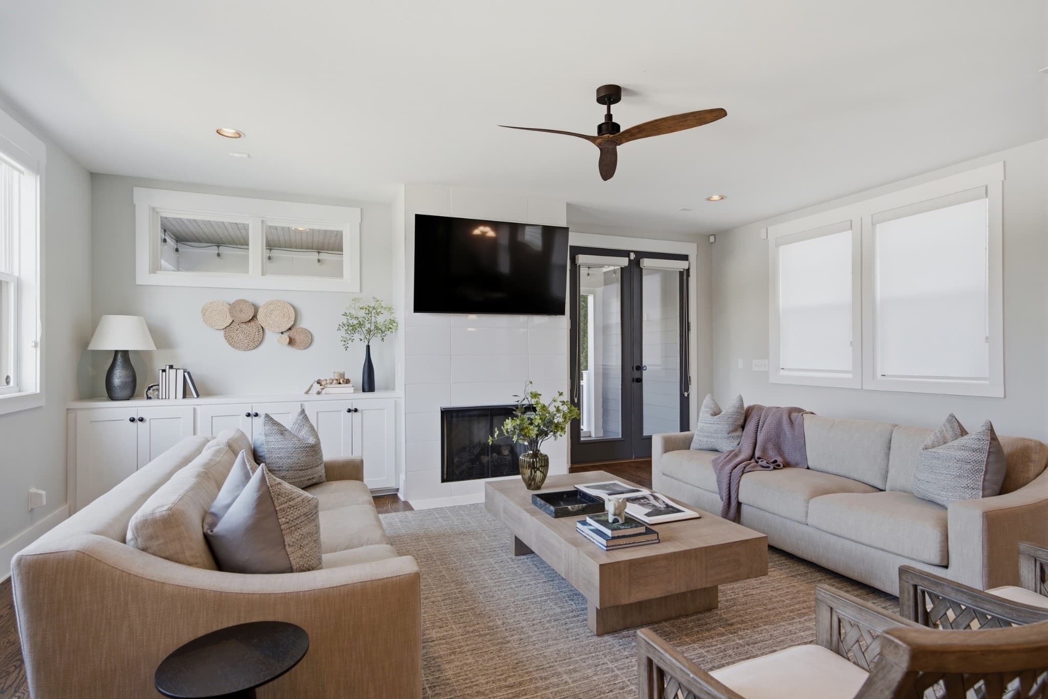 Living room with fireplace and ceiling fan at 847B Dewees Avenue in 12 South Nashville