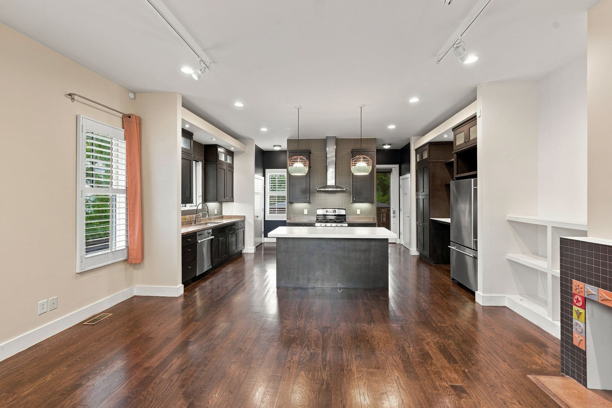 Open living area with hardwood floors at 928 Caruthers Avenue in 12 South Nashville