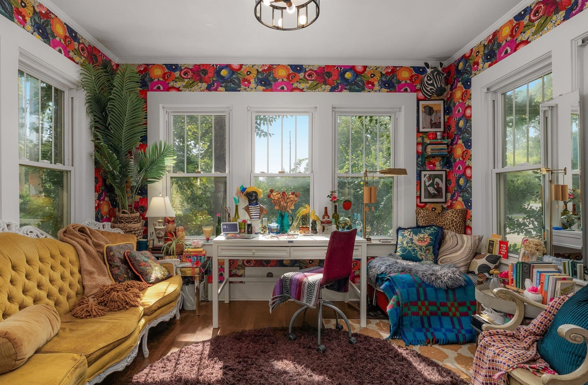 Sitting room with windows on three sides and bold floral wallpaper at 947 Gale Lane in 12 South Nashville