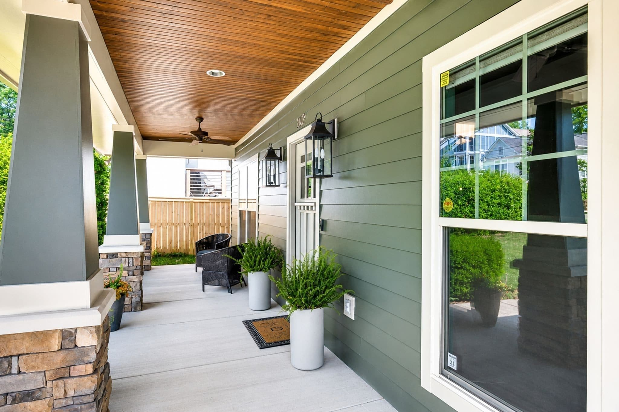 Covered front porch with a wood ceiling and ceiling fans at 1012 Acklen Avenue, 12 South Nashville