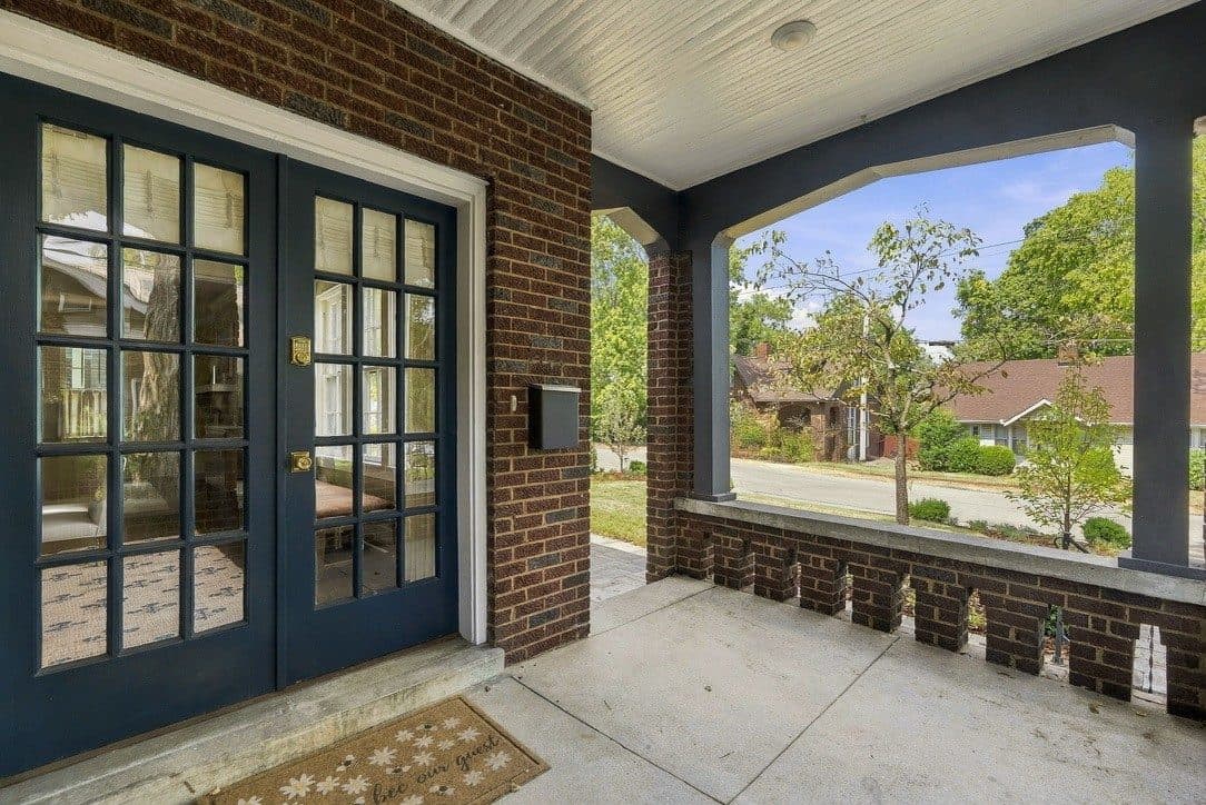 Front porch with French doors and brick walls at 1405 Clayton Avenue, 12 South Nashville