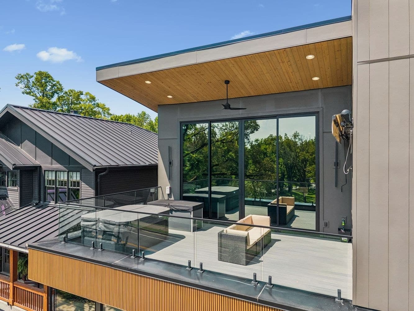 Rooftop deck with outdoor seating, glass railing, and a covered outdoor area at 3205B Granny White Pike, 12 South Nashville