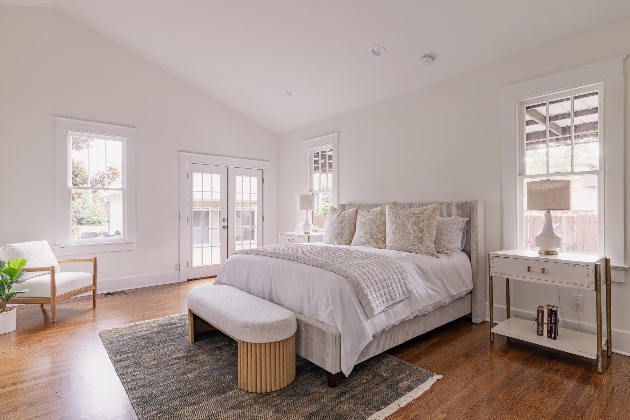 Primary bedroom with a vaulted ceiling and French doors at 941 Inverness Avenue, 12 South Nashville