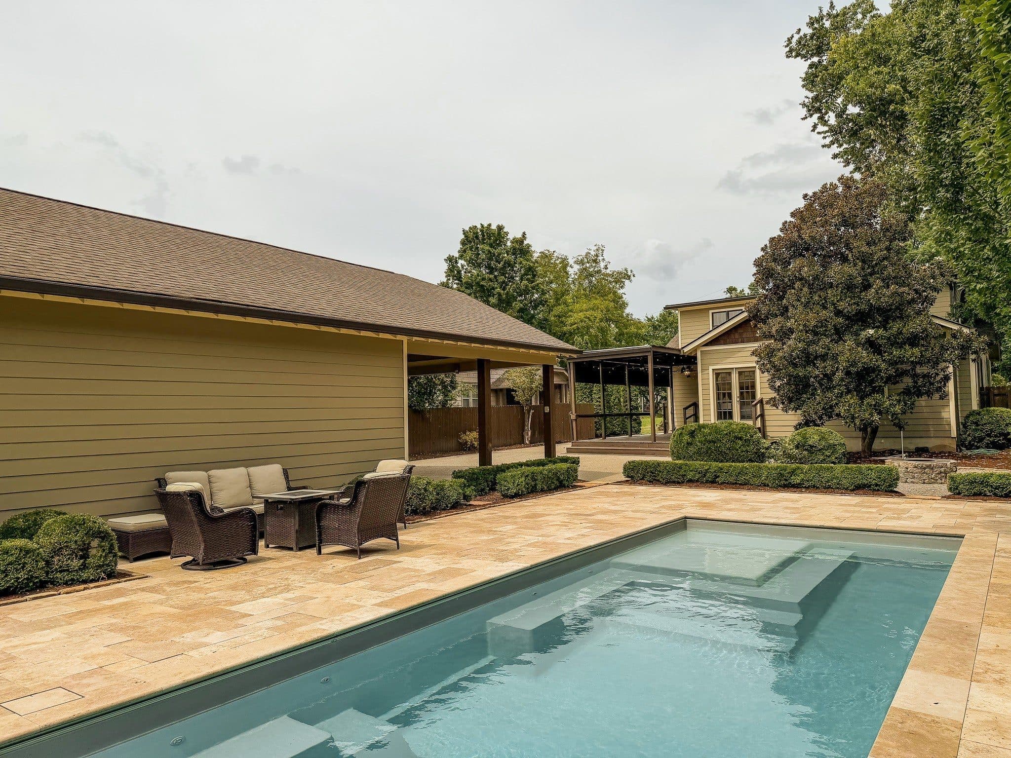 In-ground pool and stone patio in the backyard at 941 Inverness Avenue, 12 South Nashville