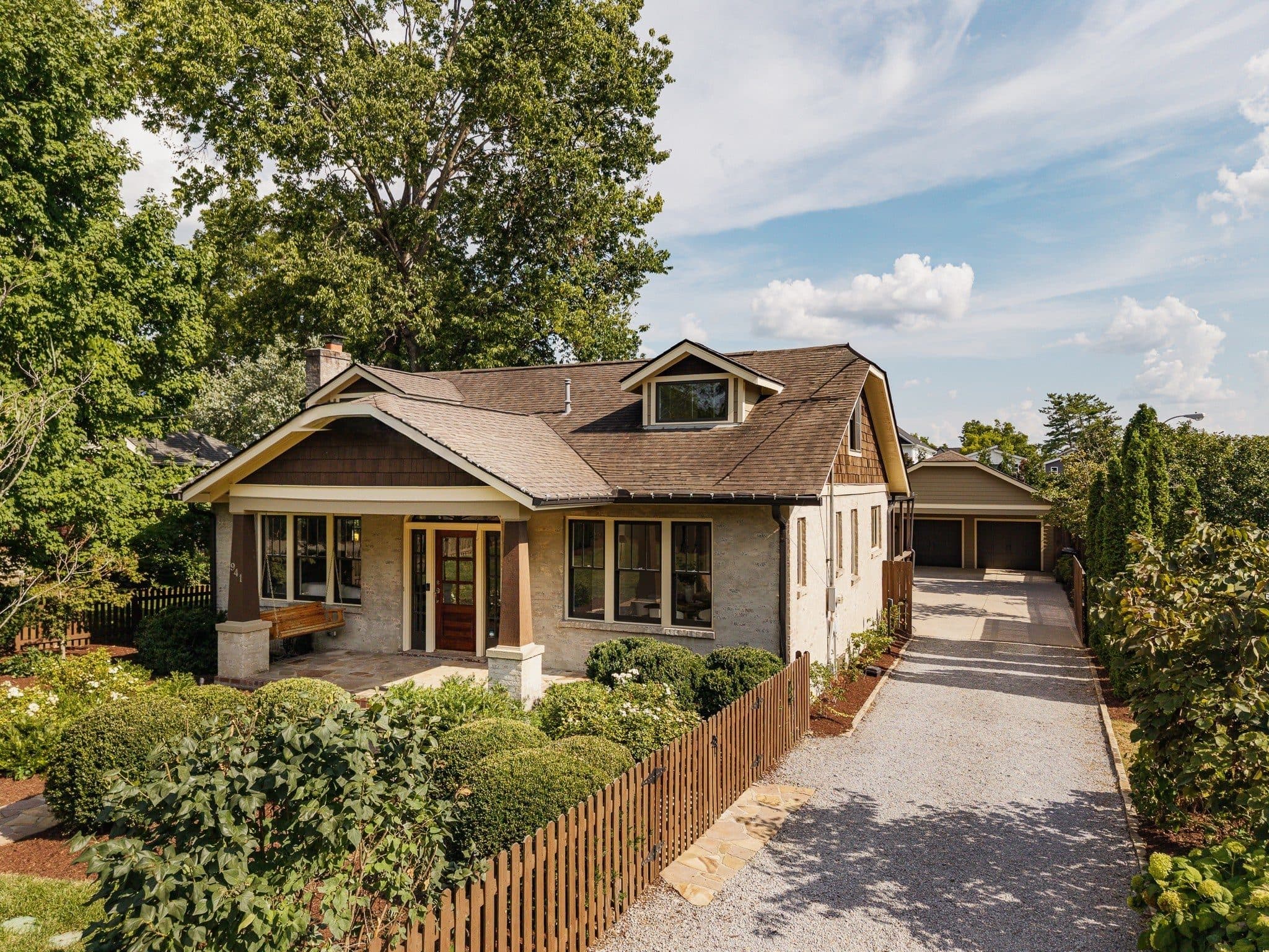 Second front exterior view with the driveway and fence at 941 Inverness Avenue, 12 South Nashville