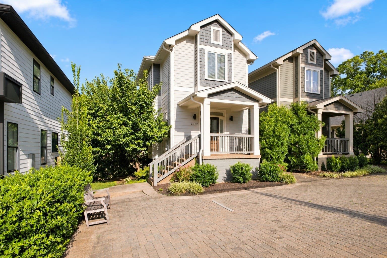 Wider front approach with porch, paver drive, and landscaping at 2822 W Kirkwood Avenue in the walkable 12 South Nashville neighborhood