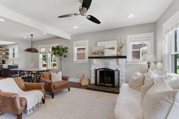 Living room with a white brick fireplace and ceiling fan at 929 Lawrence Avenue, 12 South Nashville