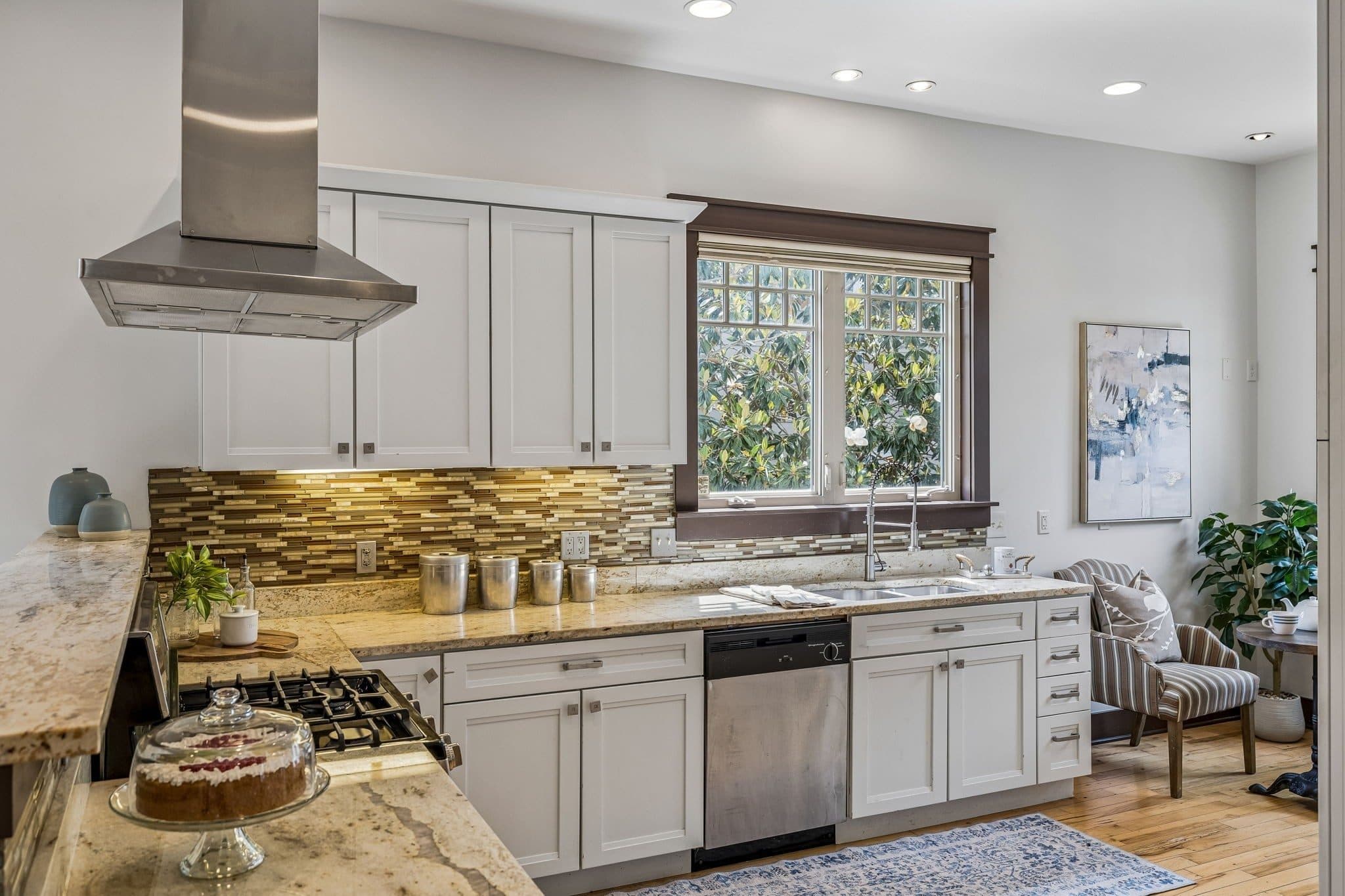 Kitchen with white cabinets, granite counters, a gas range, and a stainless hood at 925 Wedgewood Avenue, 12 South Nashville