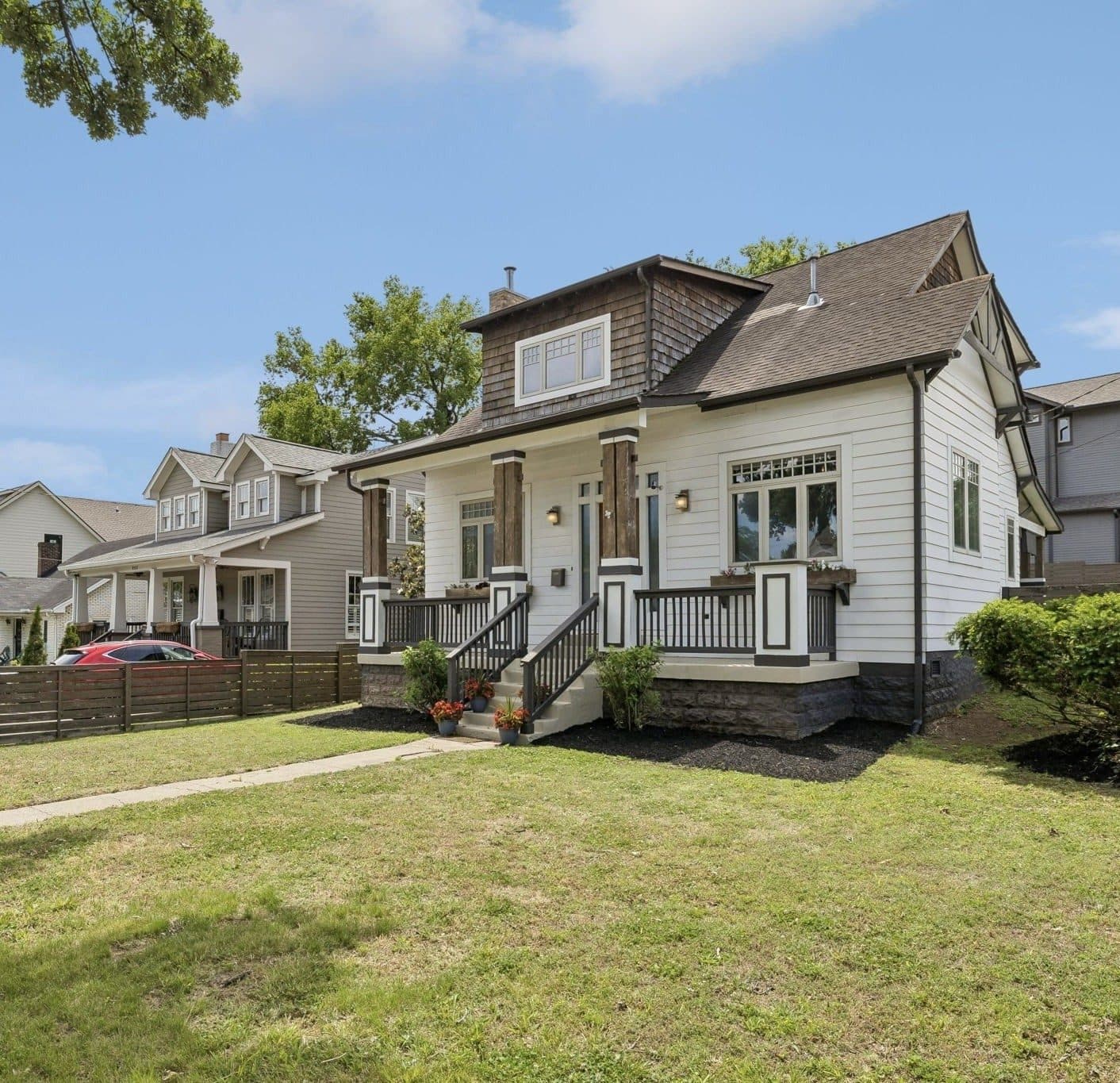 Front and side exterior with the covered porch and front lawn at 925 Wedgewood Avenue, 12 South Nashville
